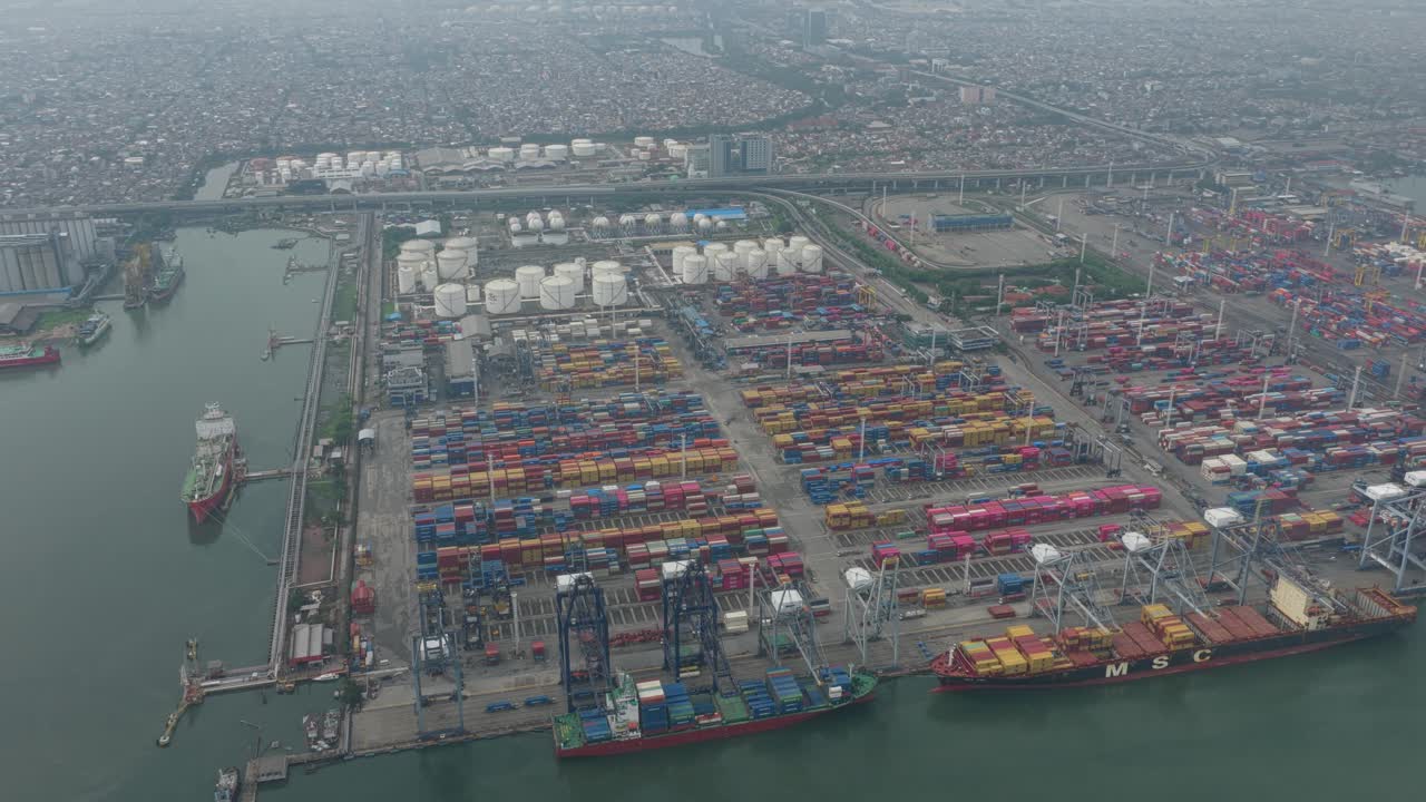 Cargo containers and ships at major logistics port in Jakarta