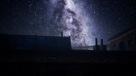 estrellas de la vía láctea por encima de la vieja fatory abandonada