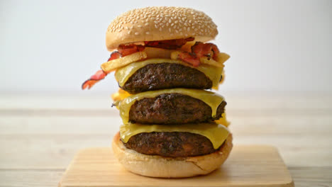 hamburger or beef burgers with cheese, bacon and french fries - unhealthy food style