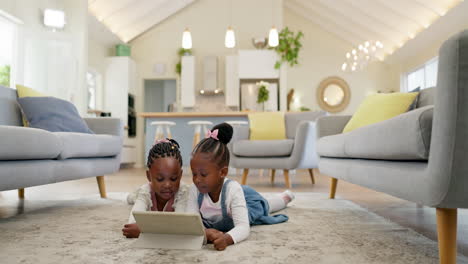 Black-girl-children-on-ground-with-tablet