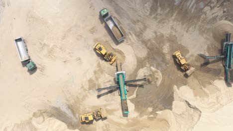 aerial view loading bulldozer in open air quarry