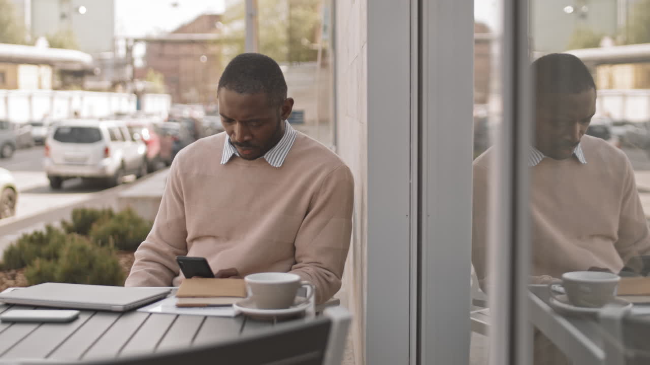 Afro American Man Paying for Lunch at Cafe