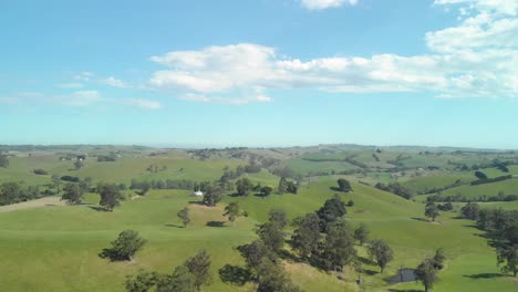 a aerial shot of the green farmlands and hills of victoria australia