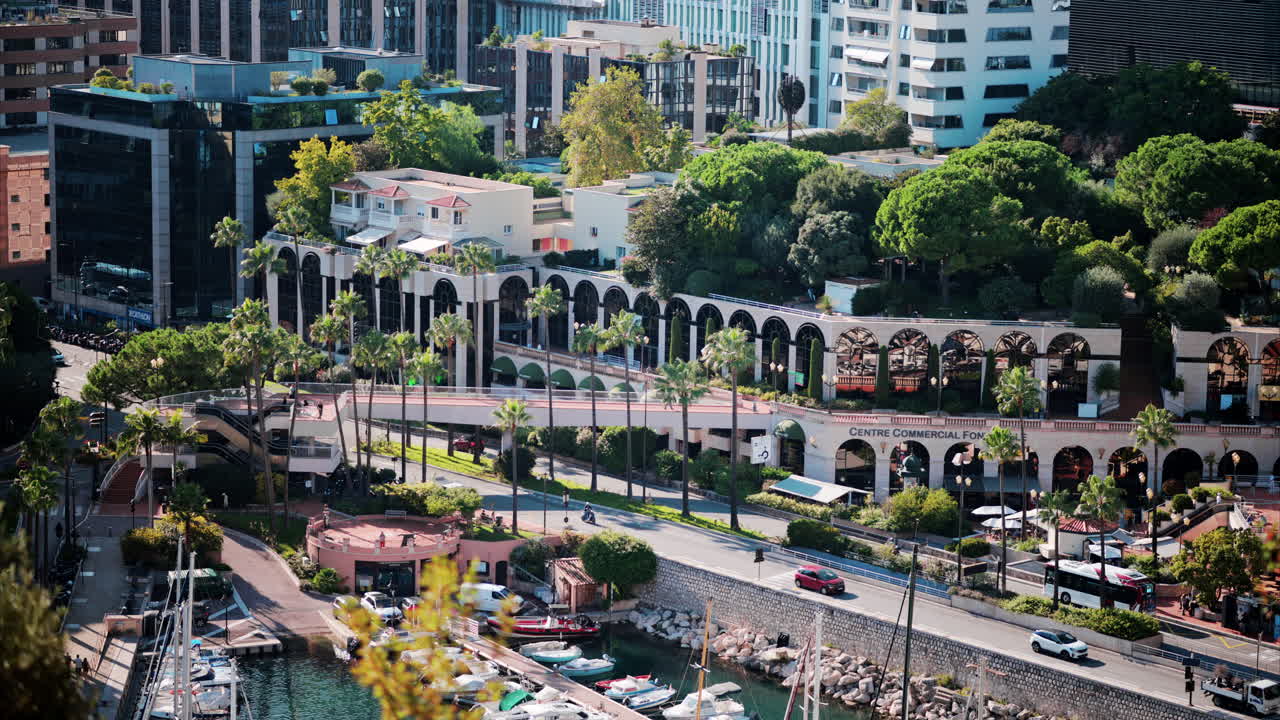 Monte Carlo, Monaco - October 4, 2024: Aerial view of boats docked in the Monaco Marina with the skyline of the city on the background