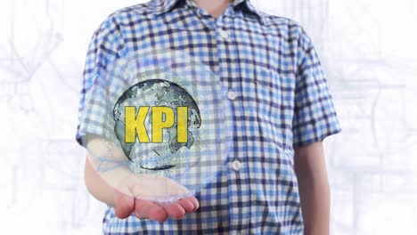 joven muestra un holograma del planeta tierra y el texto kpi