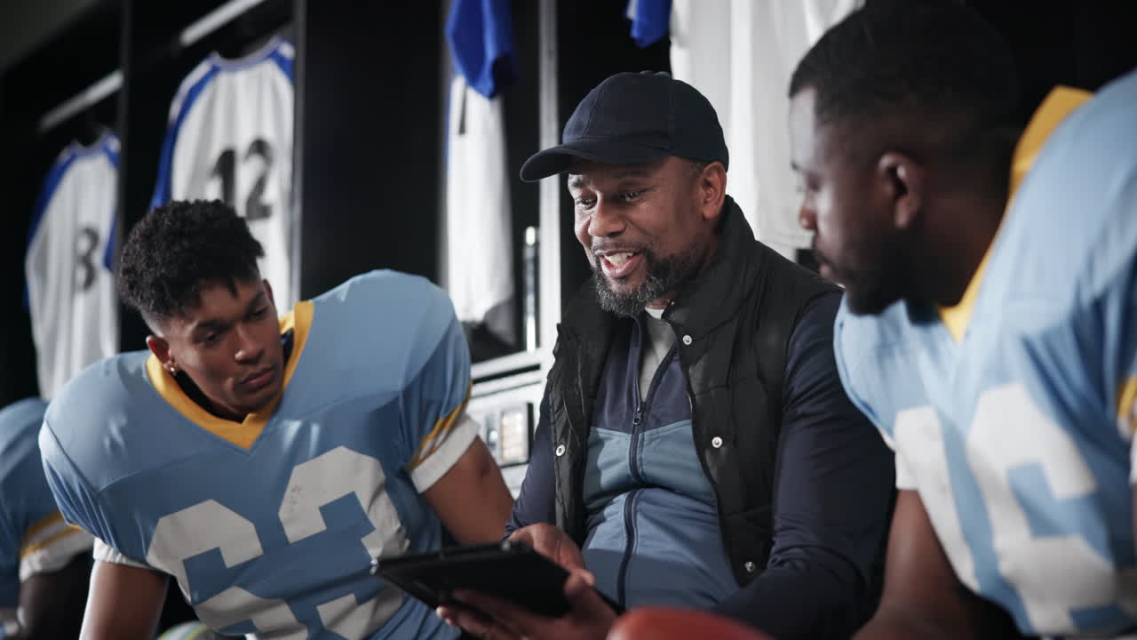 Football team meeting in locker room