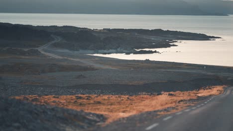 driving along the rugged rocky coastline of varanger peninsula