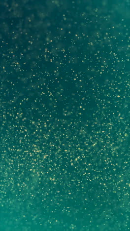 abstract teal background with gold particles