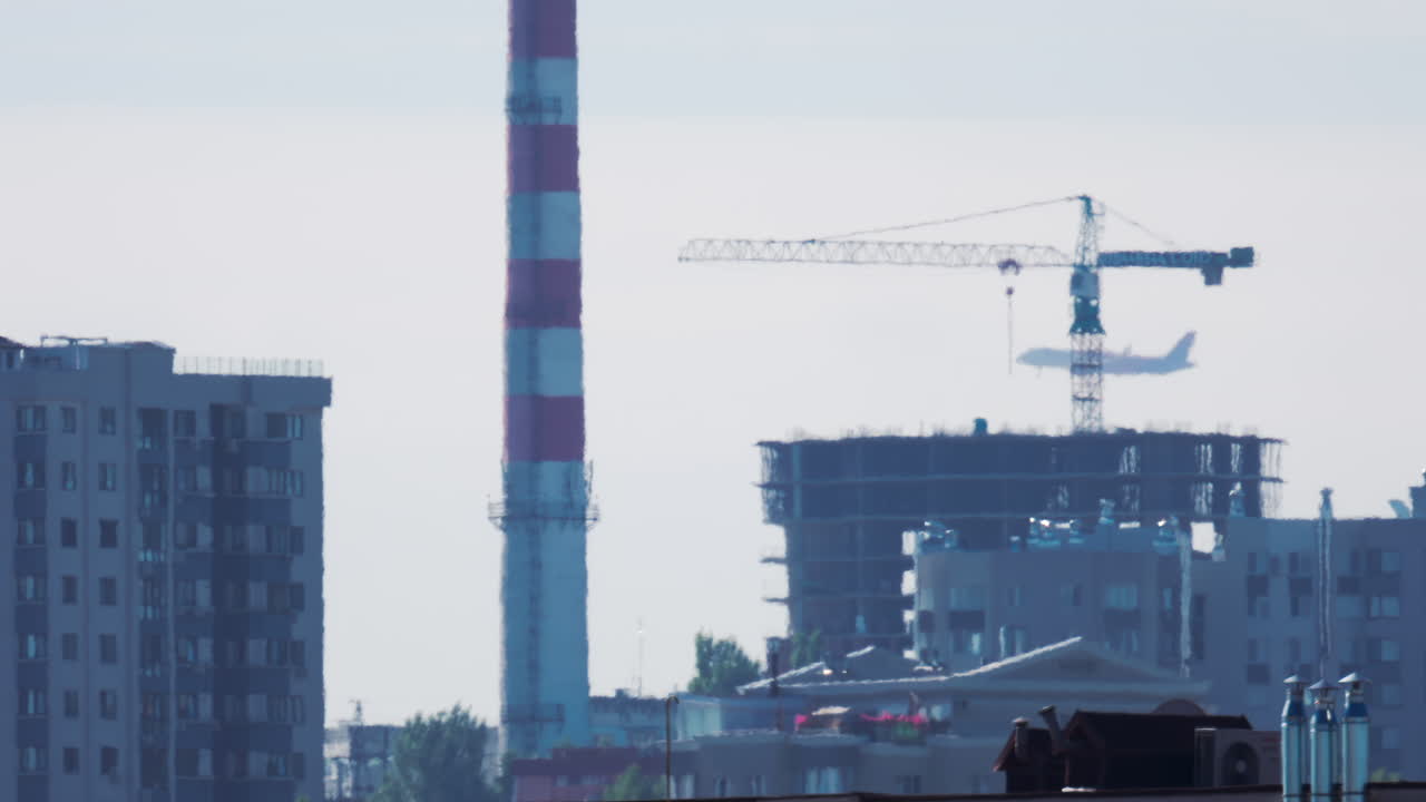 Passenger airplane approaching for landing over residential buildings