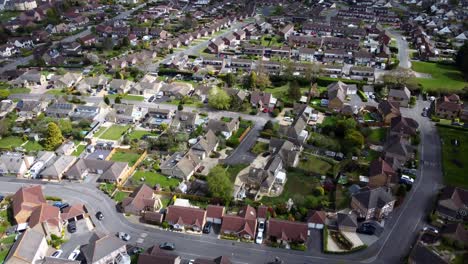 Top-down-aerial-birds-eye-view-of-suburban-town-in-Wiltshire,-England