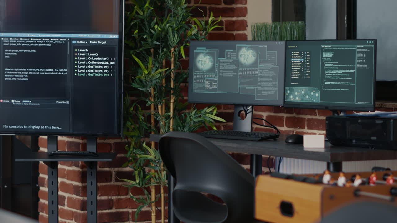 Desk with multiple computer monitors displaying neural network visualisation