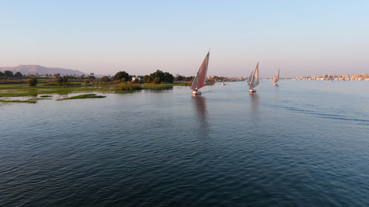Felucca sailing peacefully on Nile River in Luxor, Egypt