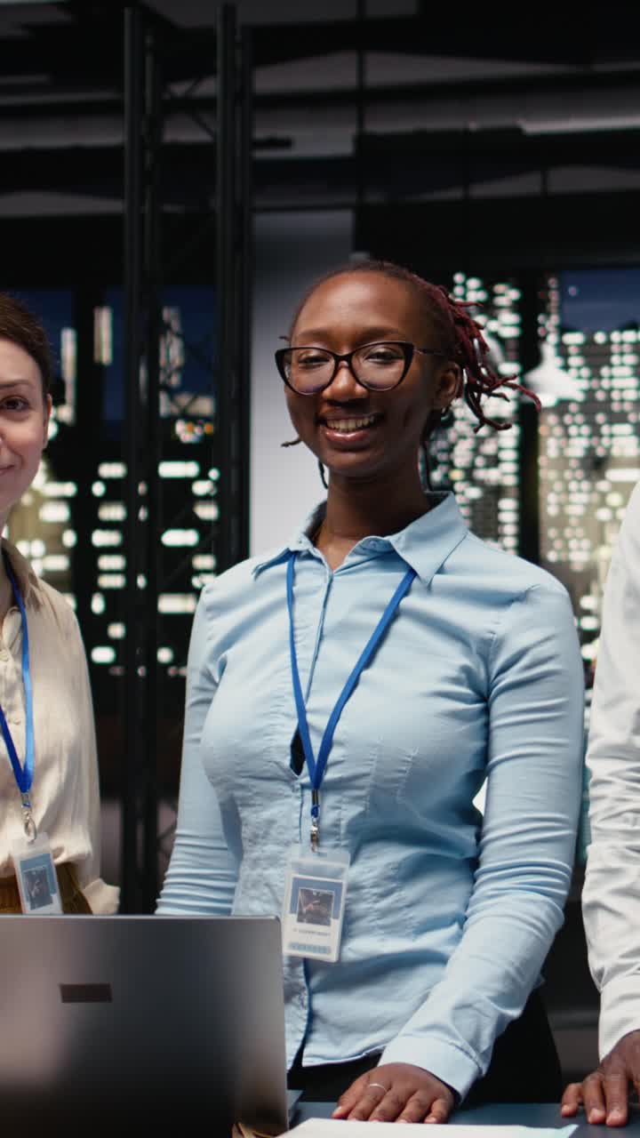 Vertical Video Diverse coworkers portrait, working late in office, collaborating on strategy