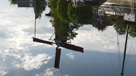 reflection of molen de roode leeuw, oldest flourmills in the gouda, netherlands