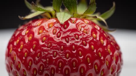 a captivating transformation: from fresh and juicy red strawberry to an overripe variant showcasing the beauty of nature’s produce