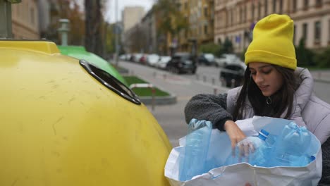 woman recycling plastic bottles