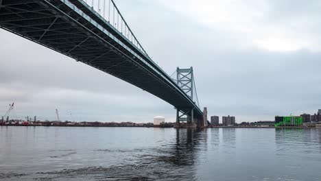 timelapse of the ben franklin bridge in philadelphia, pa during the morning in december