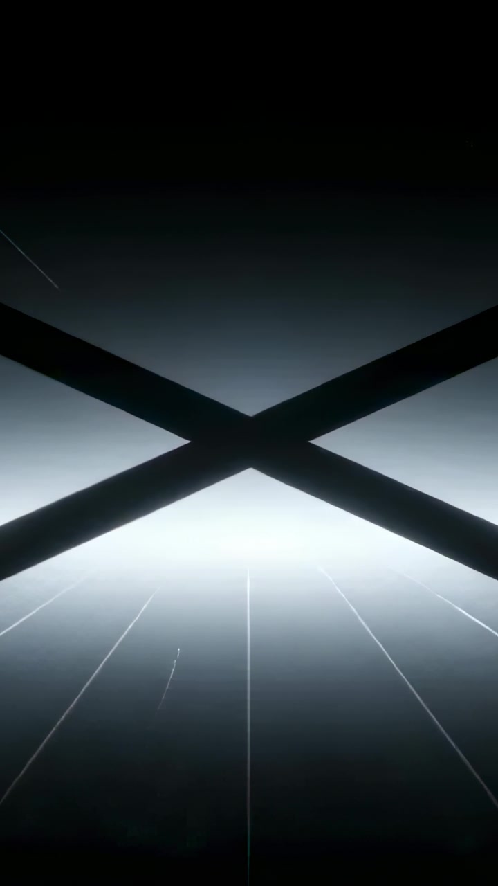 Vertical video: Pulsing X beams holding center on set, frame start sending streaks, glow pulsing