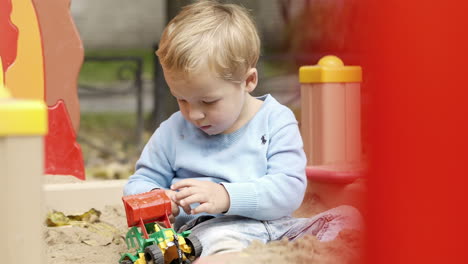 Boy-playing-with-toy-on-playground