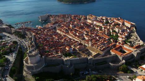 early morning of dubrovnik's old town in croatia, with medieval city walls on adriatic sea coastline. aerial orbiting shot