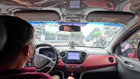 driver navigating busy hanoi traffic