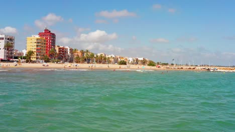 Low-drone-view-of-the-beach-of-Torreblanca-on-the-Mediterranean-coast-of-Spain