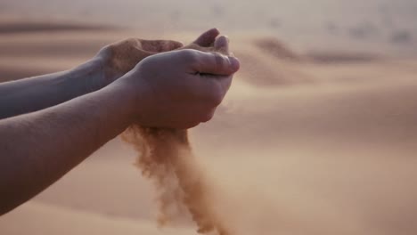 Women-joyfully-tossing-sand-in-the-desert