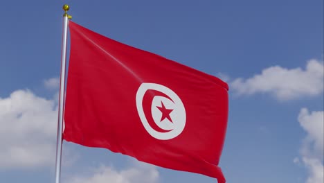 flag of tunisia moving in the wind with a clear blue sky in the background, clouds slowly moving, flagpole, slow motion