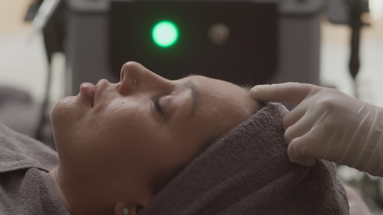 Hands of Beautician Injecting Collagen in Face of Female Client