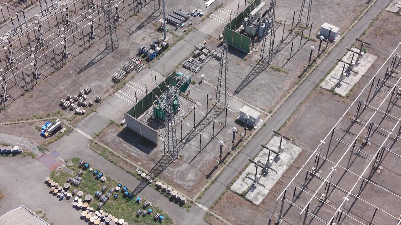 Aerial view of the Terna Baggio electrical substation in Settimo Milanese, Milan, Italy showing high-voltage transmission lines