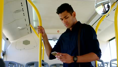 male commuter using mobile phone while travelling in bus 4k