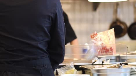 chefs working together in a busy kitchen