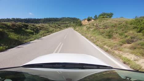 pov driver: traveling and driving on straight narrow country mountain road in peloponnese, achaia, greece