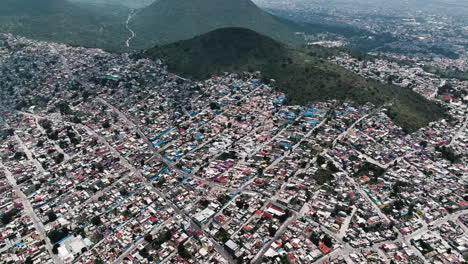 aerial view of houses colored to form dr simi face in favela, ecatepec, mexico