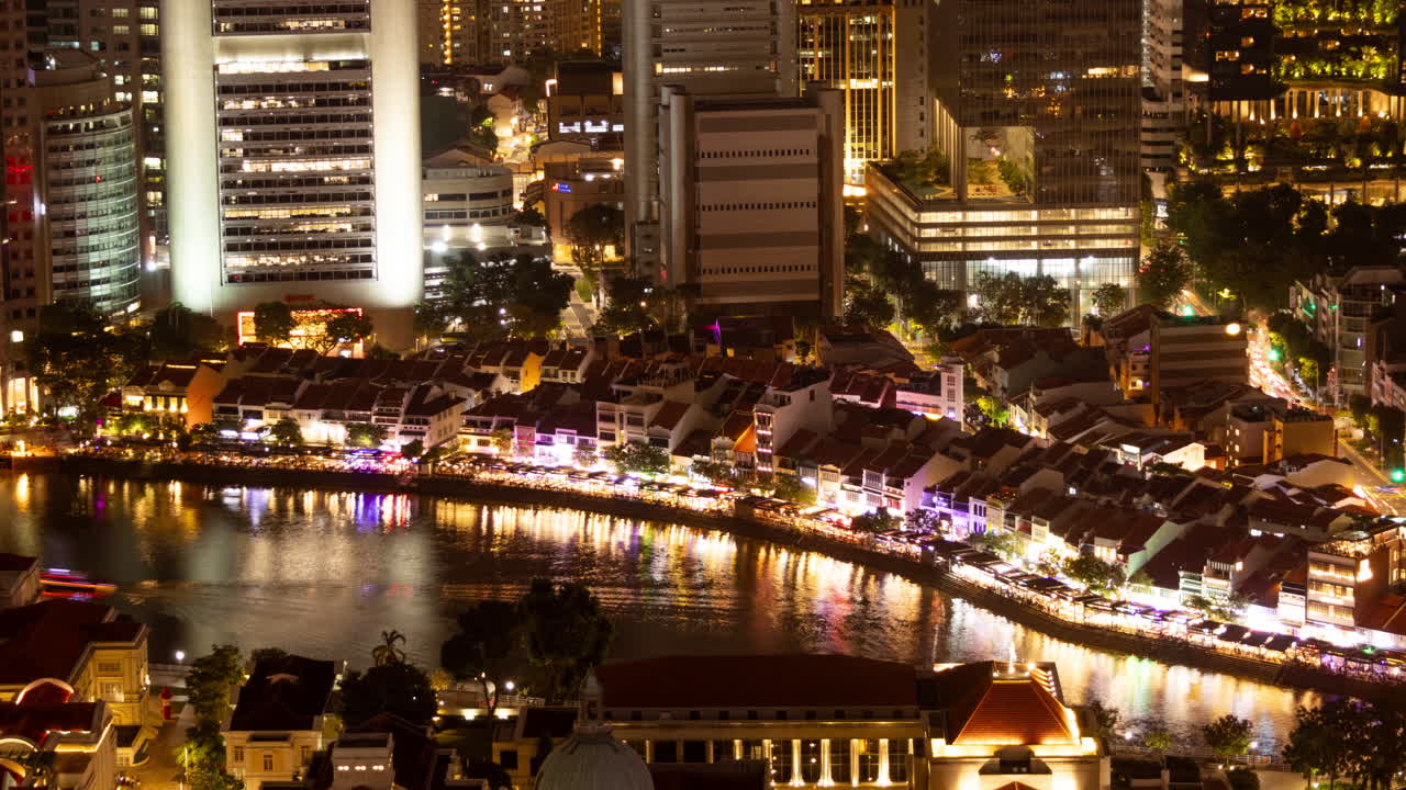SINGAPORE - 5 MARCH 2025 : timelapse of the singapore central business district skyline reflected in the river at night