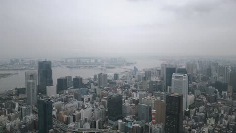 aerial scenic urban drone footage of buildings and skyscrapers in downtown tokyo in the capital city of tokyo, japan