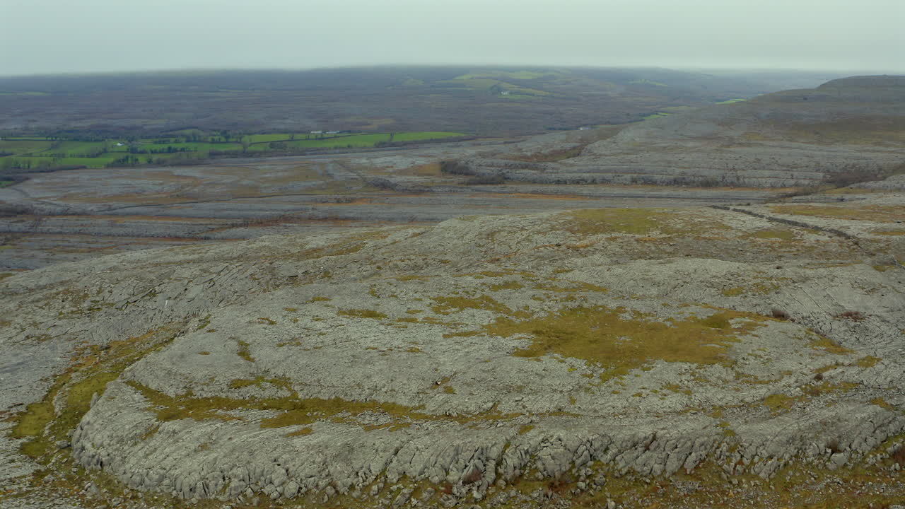 Aerial drone footage of Burren National Park, capturing rocky mountain peaks from above