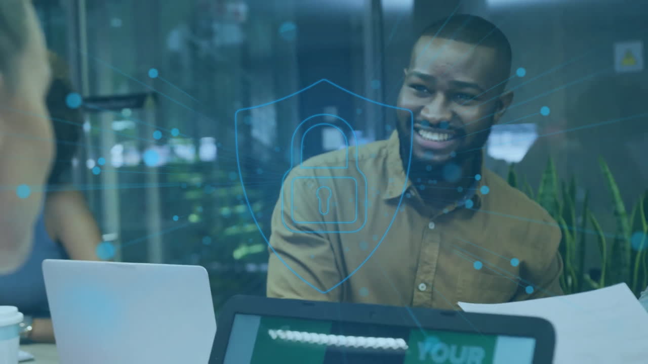Animation of financial data processing over diverse business people using laptop in office