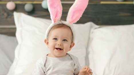 portrait of adorable baby girl with bunny ears