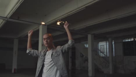 fashionable young man in an abandoned warehouse