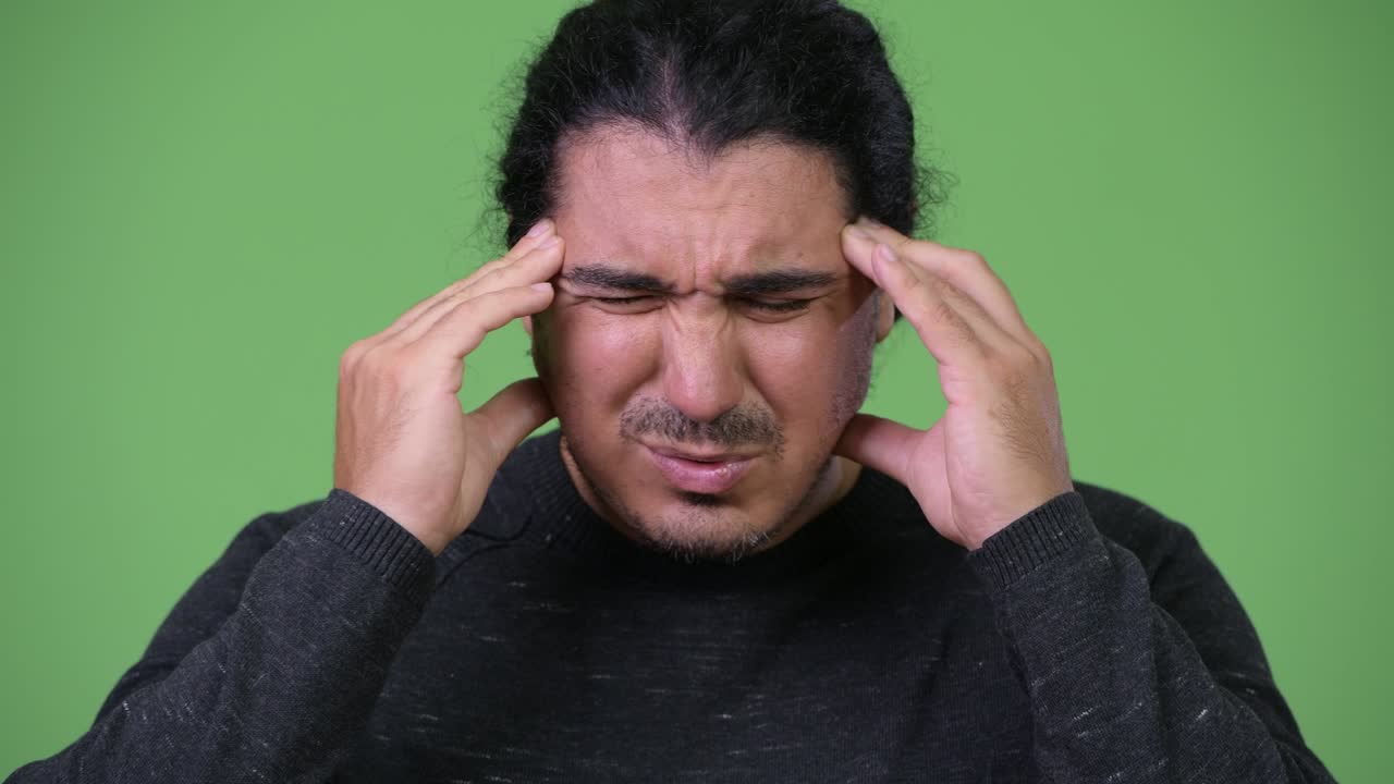 Stressed man having headache