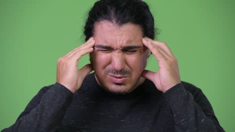 stressed man having headache