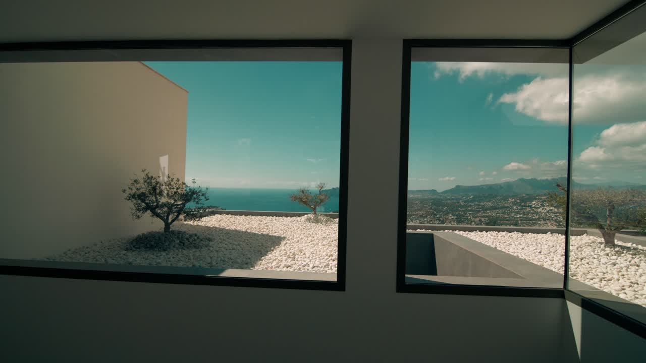beautiful designer house entrance with big window to seaside