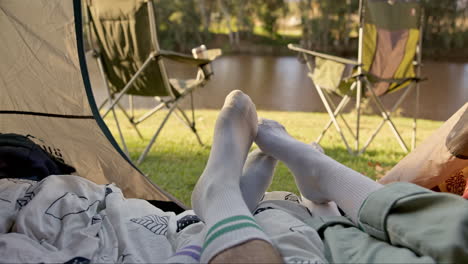 camping, tent and feet of couple with love