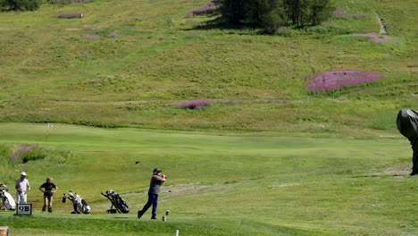 golfer swings on green field, italy