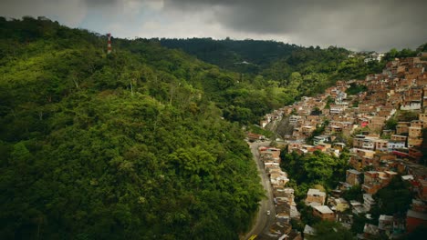 an abundance of poor homes built up a mountain in colombia, south america.