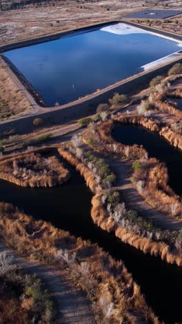 vertical drone shot of sedona wetlands arizona usa preserve wastewater treatment plant, ponds and landscape