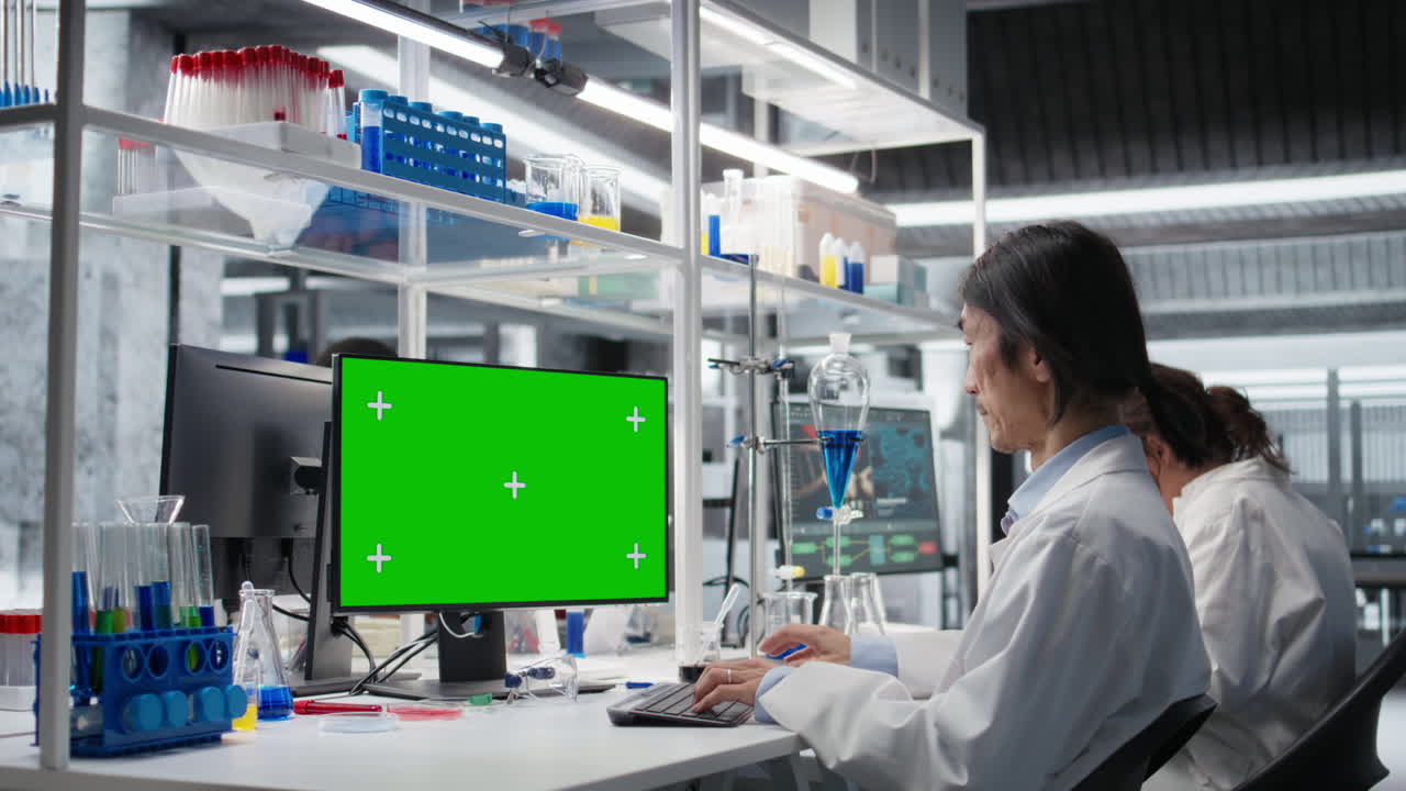 Senior Researcher Working On Isolated Screen Pc In Lab, Studying Genomics