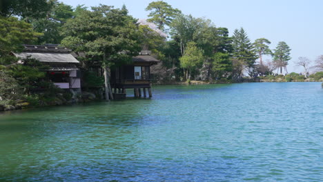 uchihashi-tei tea house and kasumiga-ike pond at kenrokuen garden in kanazawa, ishikawa, japan