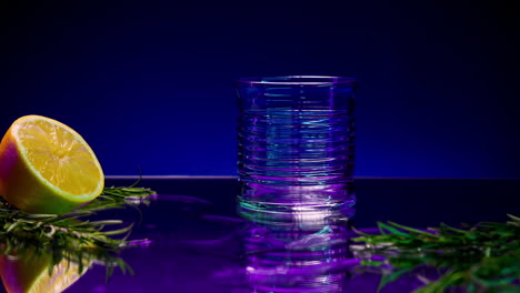 colorful cocktail glass with lemon and rosemary